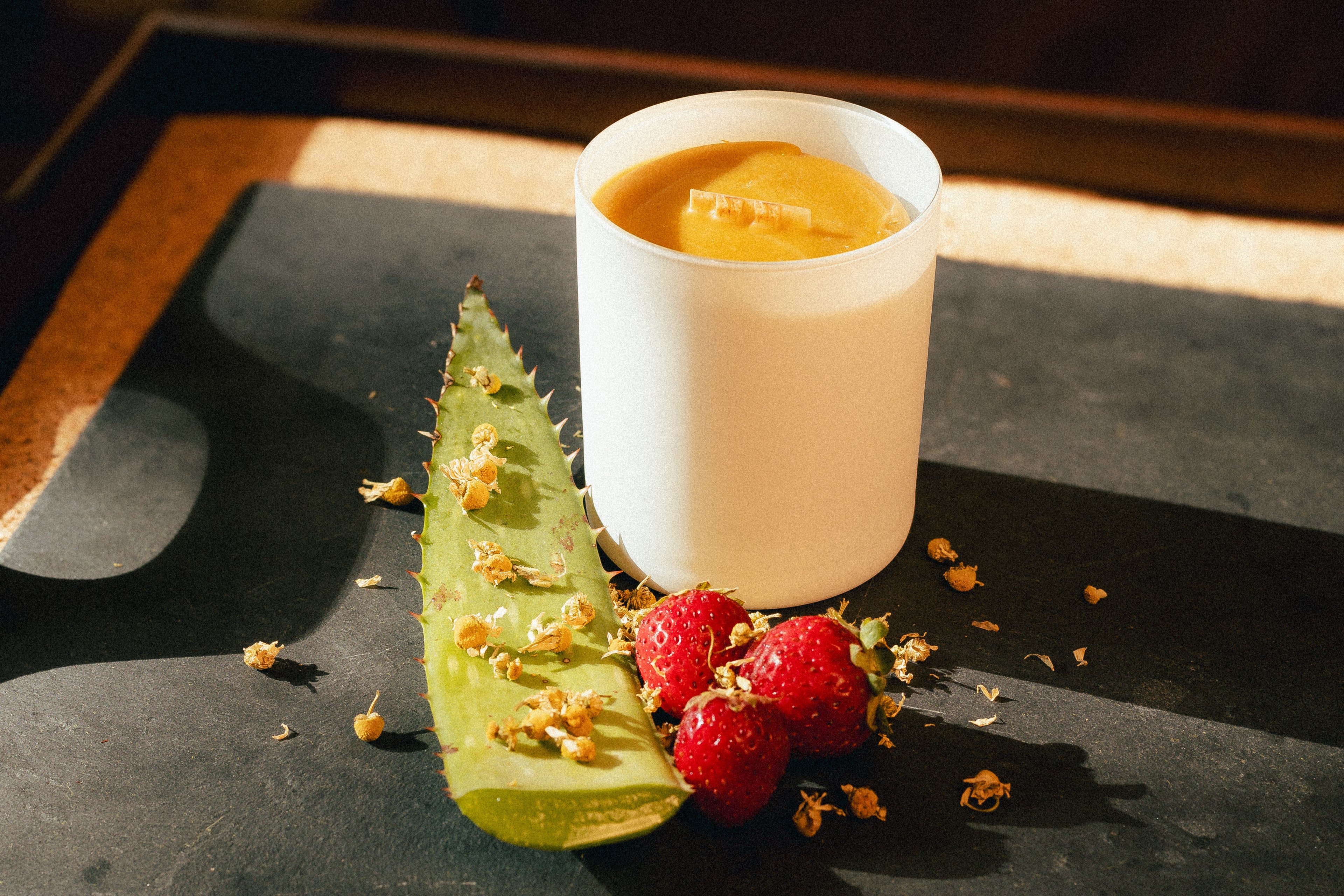 natural beeswax candle in glass jar and cork lid