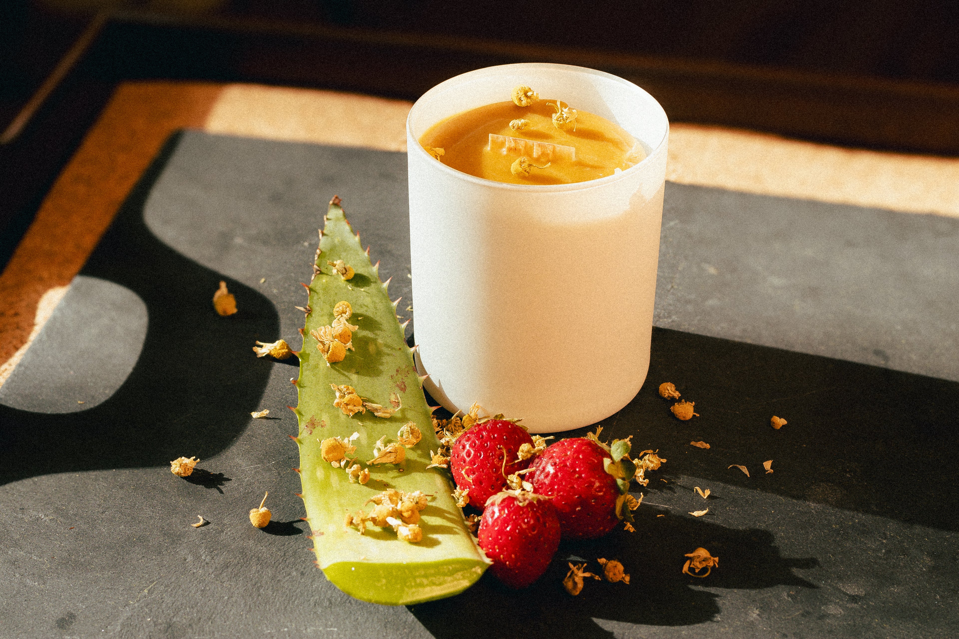 natural beeswax candle in glass jar and cork lid