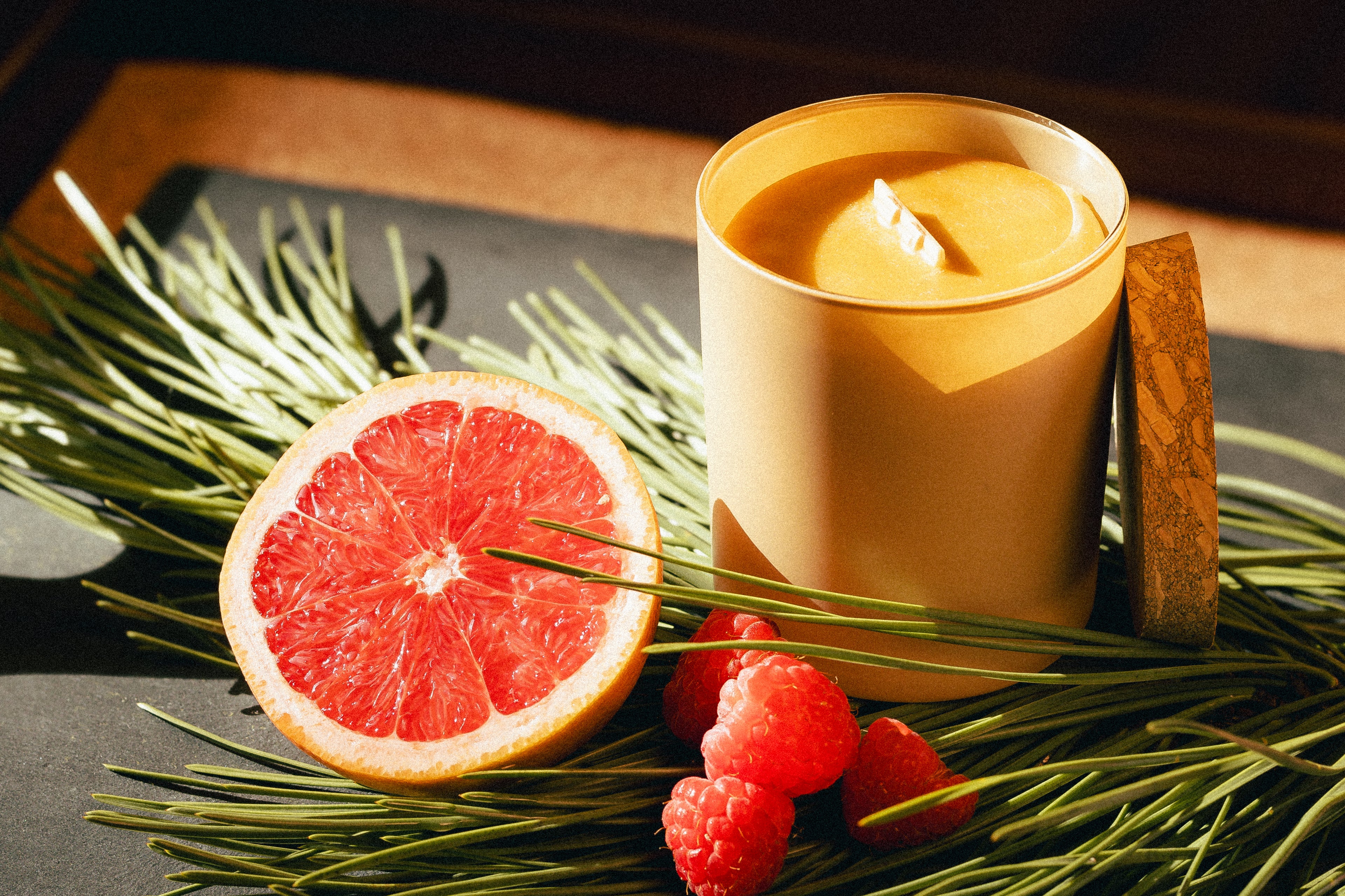 natural beeswax candle in glass jar and cork lid