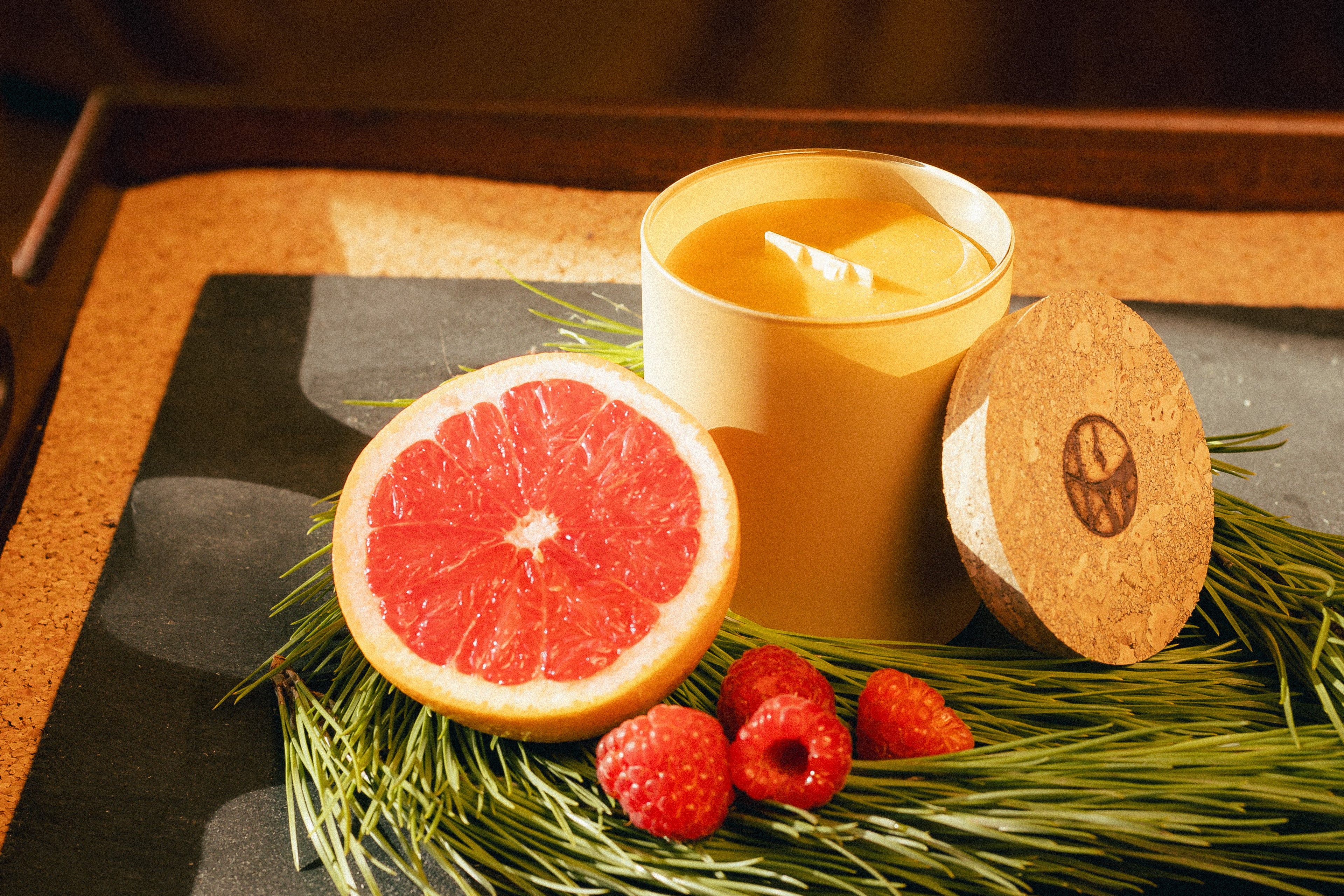 natural beeswax candle in glass jar and cork lid