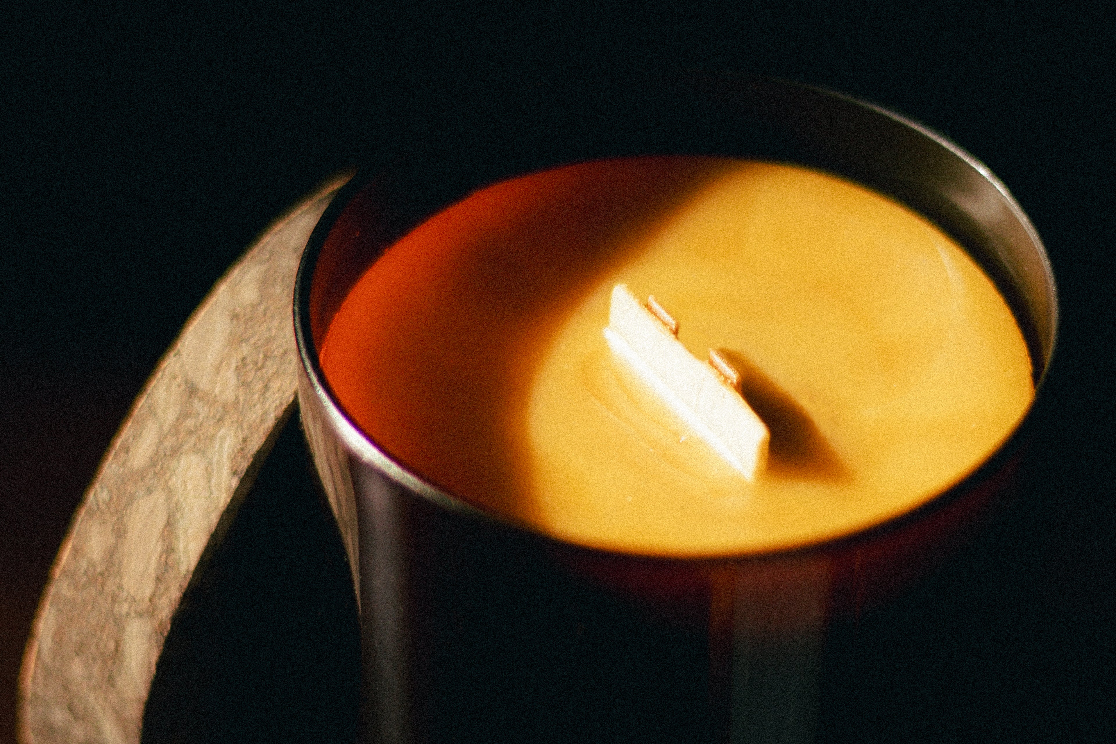 natural beeswax candle in glass jar and cork lid